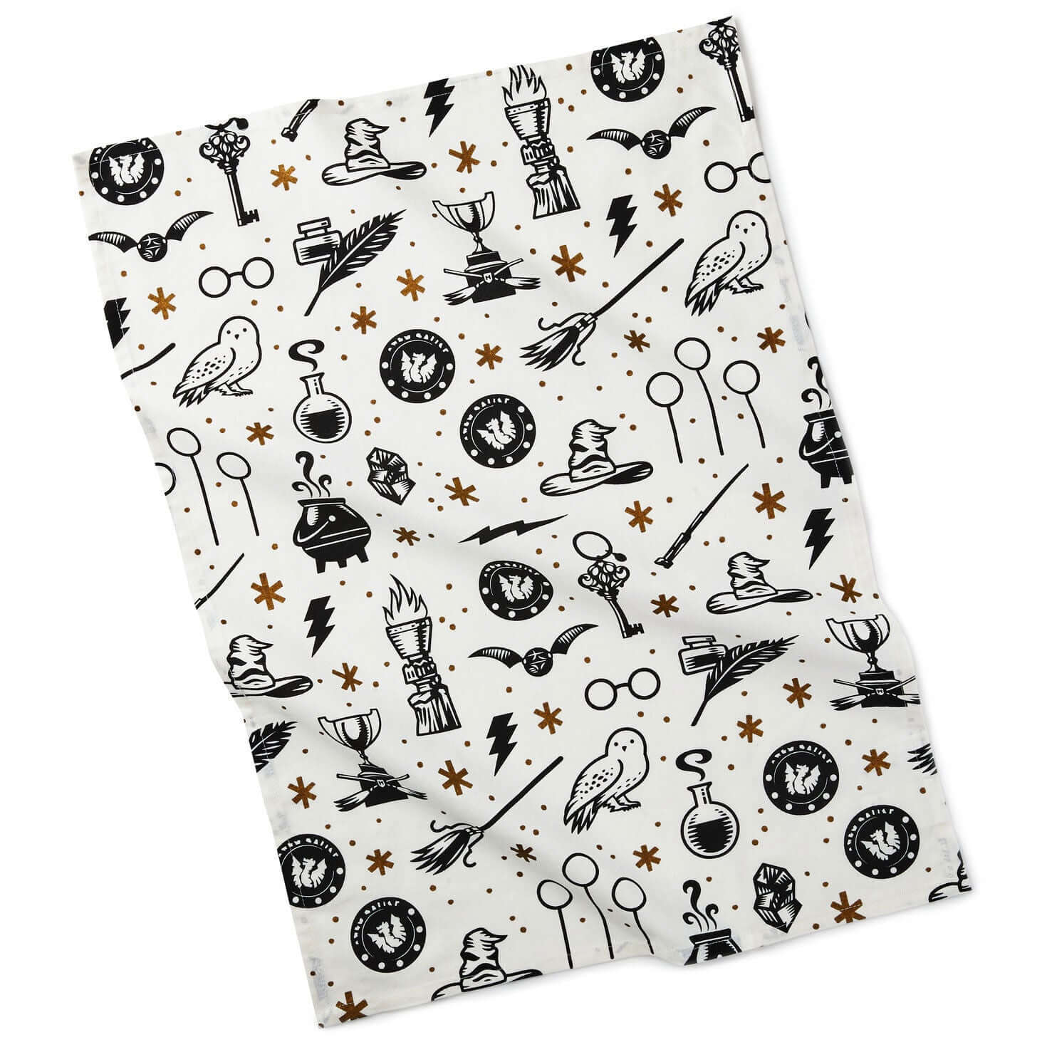 Harry Potter™ Wizarding World™ Icons Tea Towel in white cotton featuring black symbols and gold accents in a flat lay.