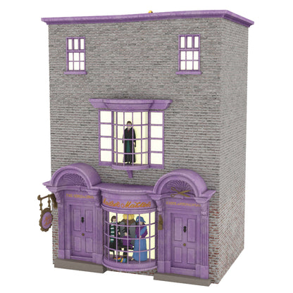 Harry Potter™ Madam Malkin's Robes for All Occasions™ — Hallmark Keepsake Christmas Ornament featuring a detailed grey brick building with purple entrance.