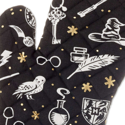 Harry Potter™ Magical Icons Oven Mitt in black cotton with white and metallic gold pattern showcasing iconic symbols and characters.