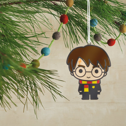 Harry Potter™ Moving Metal Hallmark Ornament, colourful character design, hanging on a pine tree branch with festive decorations.