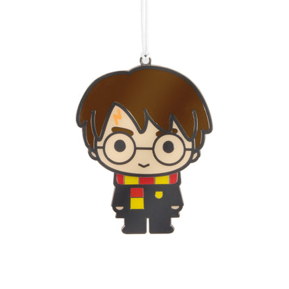 Harry Potter™ Moving Metal Hallmark Ornament, colourful metal decoration in Gryffindor robes with wiggle feature, flat lay view.