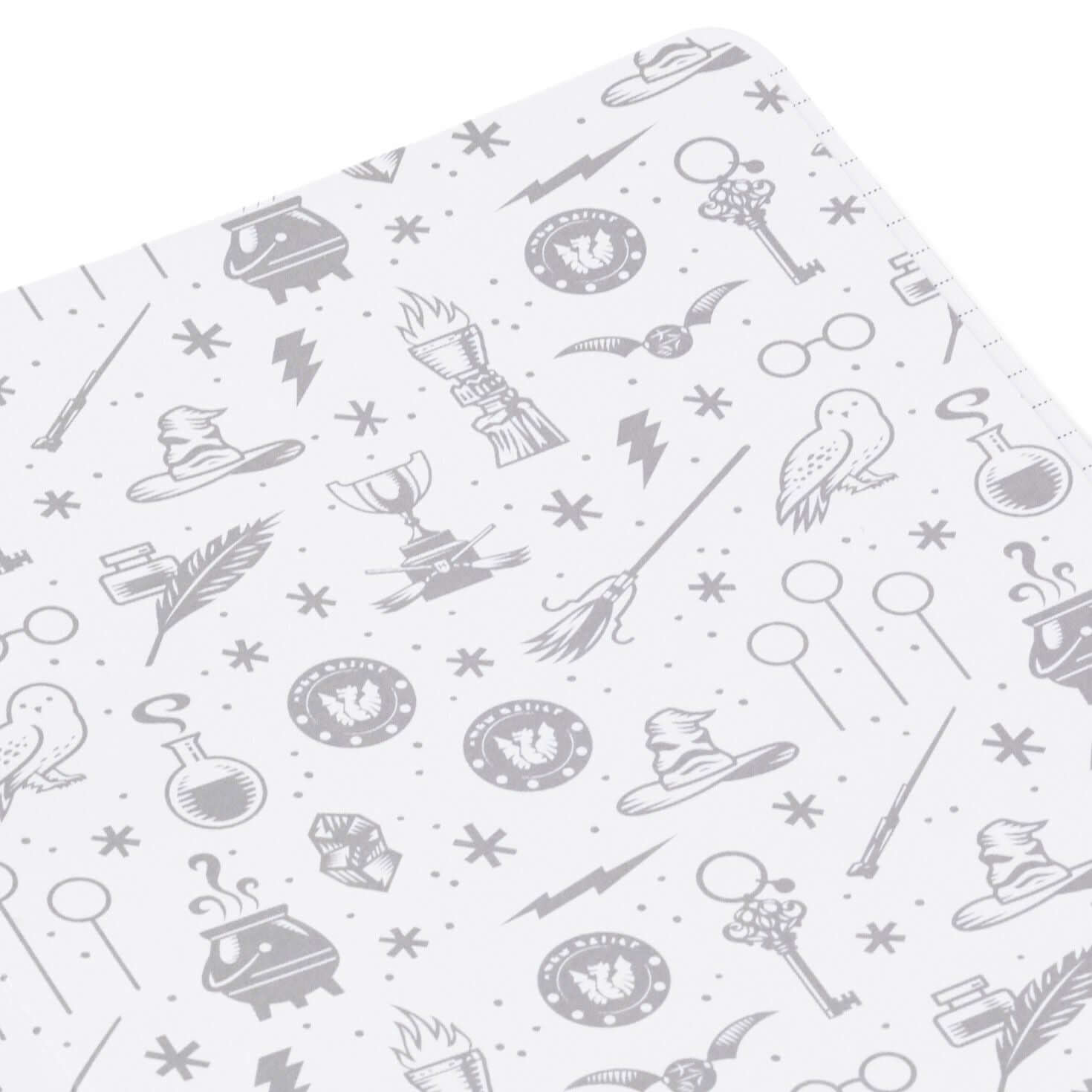 Harry Potter™ faux leather journal, 6.18x8.25, featuring grey patterned illustrations of wizarding items on a white background.