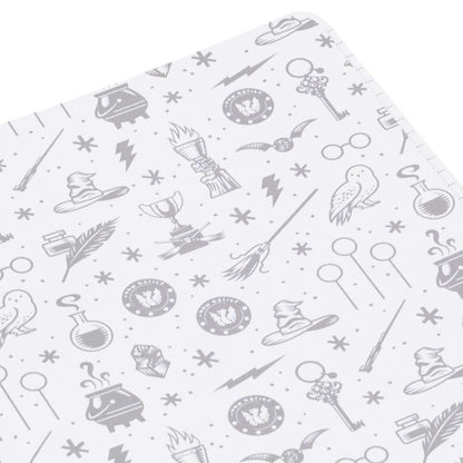 Harry Potter™ faux leather journal, 6.18x8.25, featuring grey patterned illustrations of wizarding items on a white background.