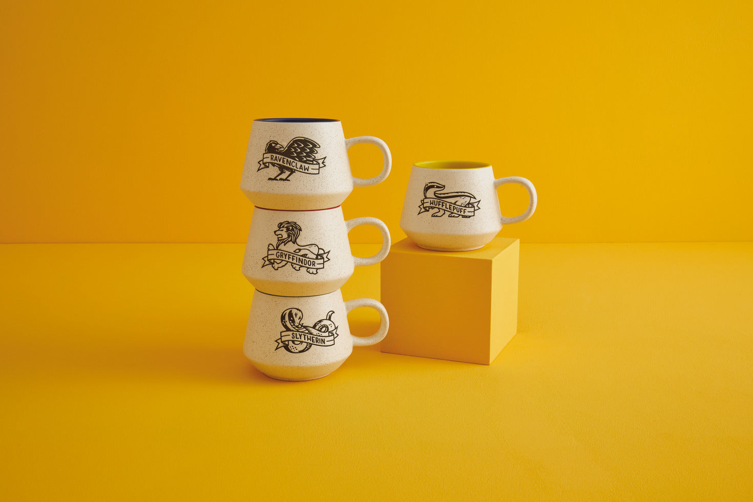 Harry Potter™ Retro Ravenclaw™ Mug, 770ml stacked against a yellow background showcasing speckled ceramic and blue interior glaze.
