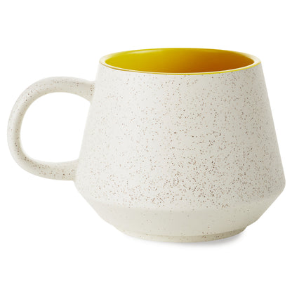 Harry Potter™ Retro Hufflepuff™ Mug, 770ml in speckled ceramic with yellow interior, angled view showing wide bottom design