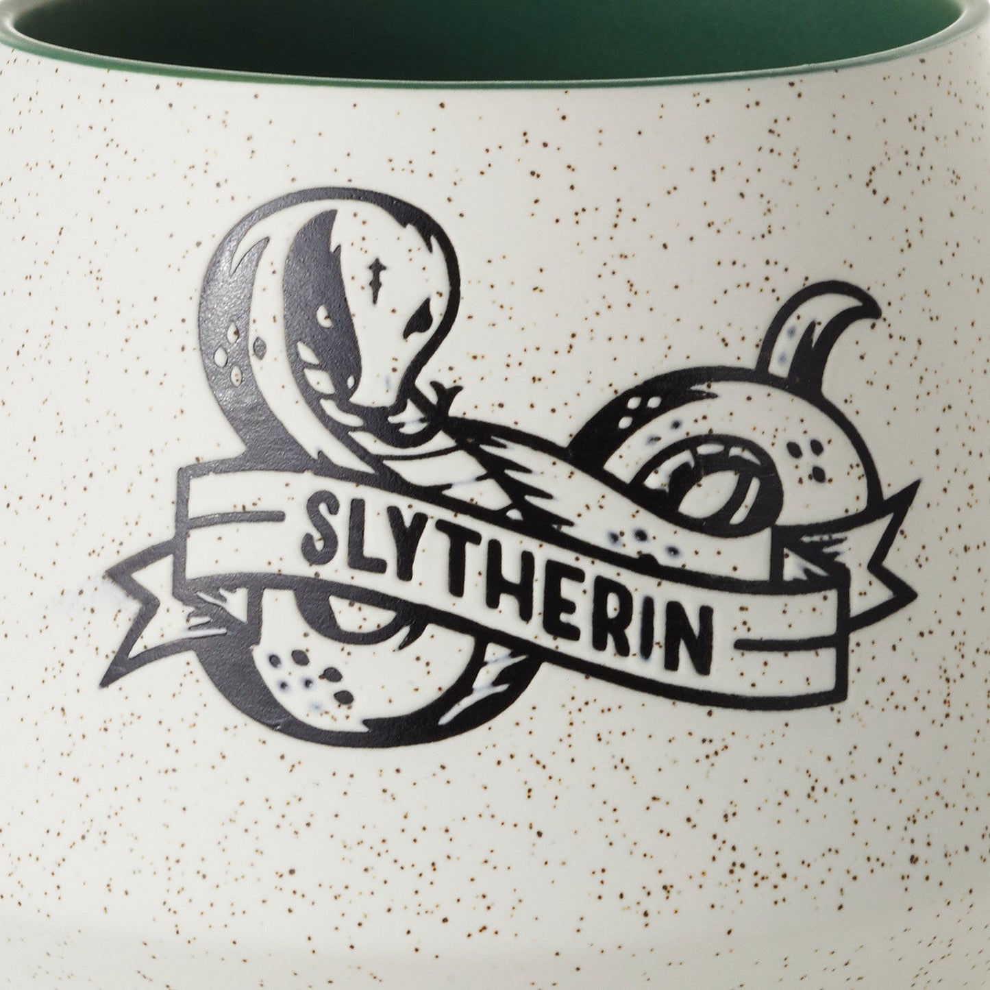 Harry Potter™ Retro Slytherin™ Mug, 770ml featuring a detailed serpent graphic and banner on a speckled ceramic surface.