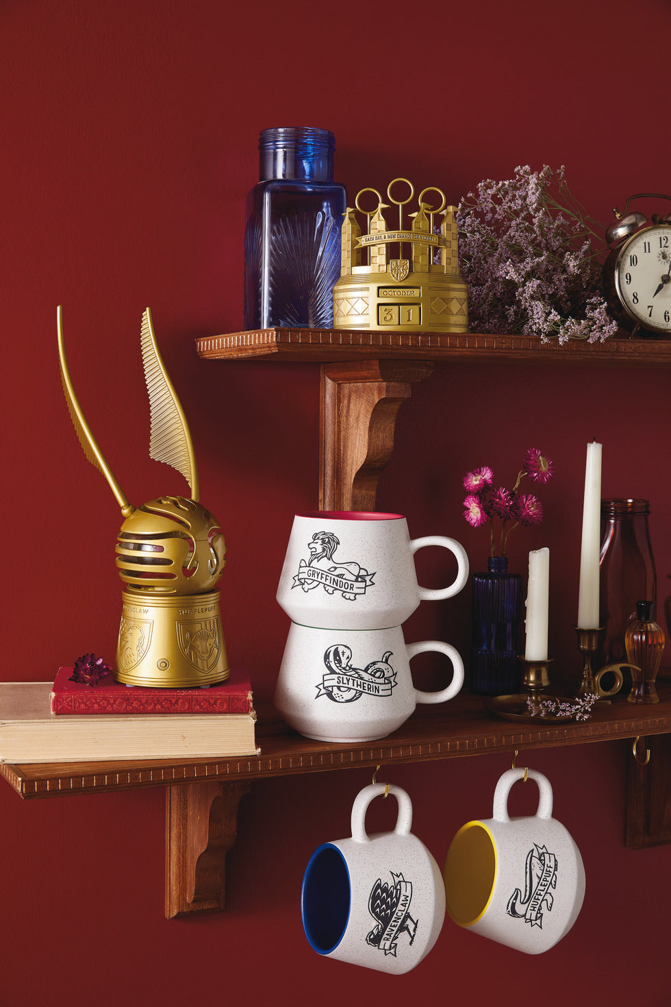 Harry Potter™ Retro Slytherin™ Mug, 770ml displayed on a shelf with decorative items, ceramic with serpent design and contrasting handles.