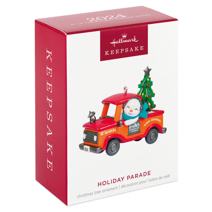 Holiday Parade — Hallmark Keepsake Christmas Ornament in festive box, featuring a cheerful snowman truck with a Christmas tree.