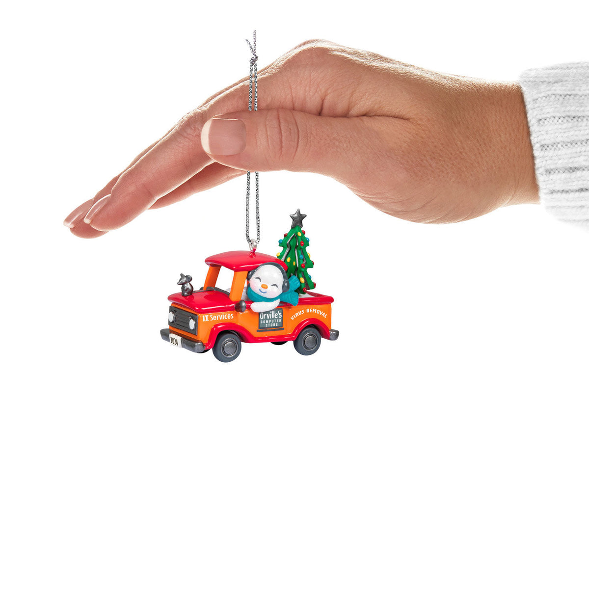 Holiday Parade — Hallmark Keepsake Christmas Ornament, snowman truck ornament held in hand against white background.