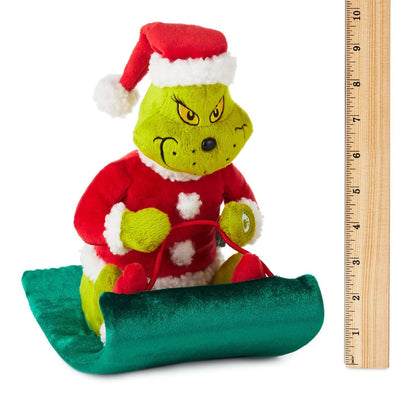 Dr. Seuss's How the Grinch Stole Christmas!™ Grinch on sled musical plush with motion in Santa suit, 25 cm tall, with measuring ruler