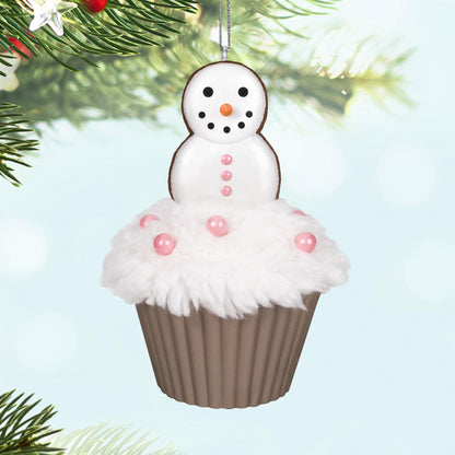 Merry Macarons, 16th in the Christmas Cupcakes Series — 2025 Hallmark Keepsake Christmas Ornament, featuring a snowman on fluffy icing with pink pearl candies, close up.