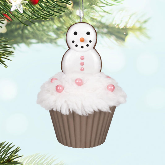 Merry Macarons, 16th in the Christmas Cupcakes Series — 2025 Hallmark Keepsake Christmas Ornament, featuring a snowman on fluffy icing with pink pearl candies, close up.