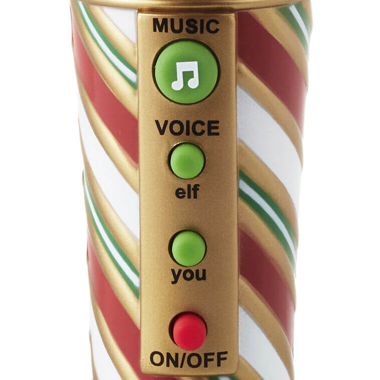 Merry-Okee Christmas Interactive Microphone control panel featuring music and voice selection buttons in festive colours and design.