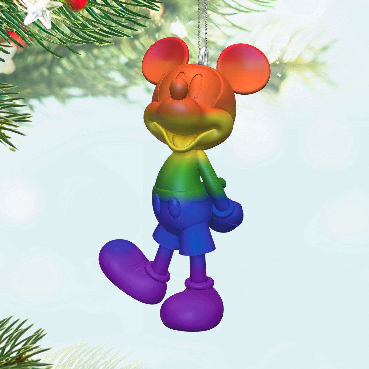Disney Mickey Mouse, Rainbow Mickey — Hallmark Keepsake Christmas Ornament, vibrant rainbow colours, hanging from Christmas tree.
