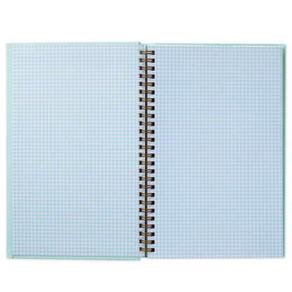 My First Year Baby Book - Blue open to two pages with light blue checkered design and spiral binding.