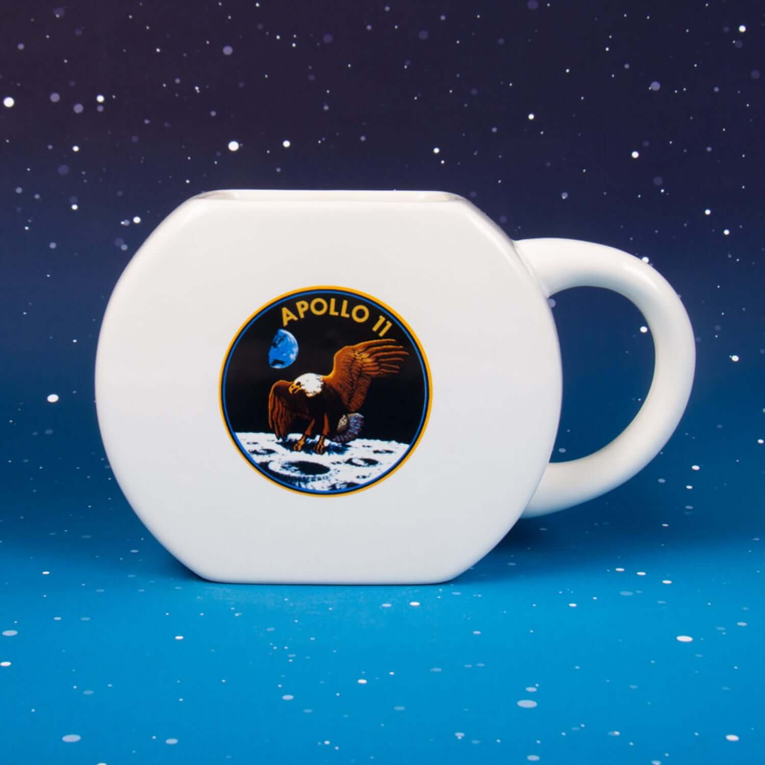 NASA Mug & Puzzle featuring an octagonal white mug with Apollo 11 logo on a starry background.