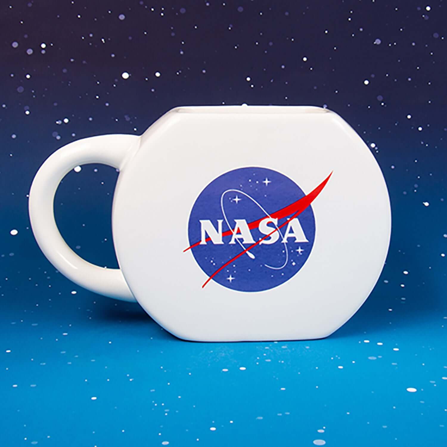 NASA Mug & Puzzle featuring a white, octagonal-shaped mug with the NASA logo and starry background.
