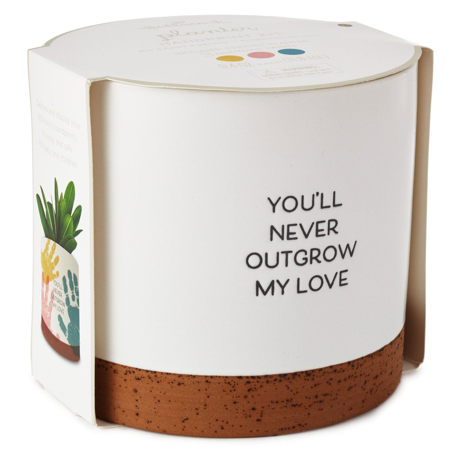 Never Outgrow My Love Planter Handprint Kit, ceramic planter with hand-drawn artwork, angled view showcasing packaging design.