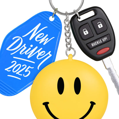 New Driver — 2025 Hallmark Keepsake Christmas Ornament featuring a blue keychain tag, car key, and a cheerful yellow smiley face.