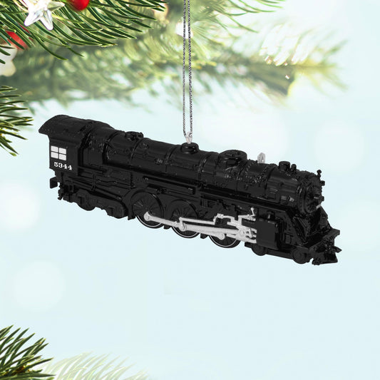 New York Central 700E Hudson Locomotive, 30th in the LIONEL® Trains Series — 2025 Hallmark Keepsake Christmas Ornament, black detail, hanging on pine bough.