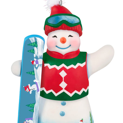 Ollie U. Halfpipe, 21st in the Snowtop Lodge Series — 2025 Hallmark Keepsake Christmas Ornament, festive snowman with snowboard and green vest, close up.