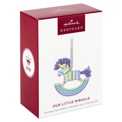 Our Little Miracle — 2025 Hallmark Keepsake Christmas ornament in gift packaging, featuring a pastel striped rocking horse design.