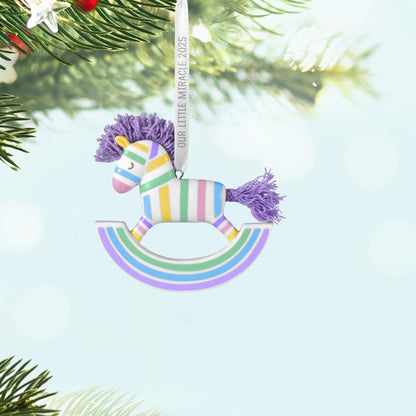 Our Little Miracle — 2025 Hallmark Keepsake Christmas Ornament, pastel striped rocking horse with lavender mane, hanging on tree.