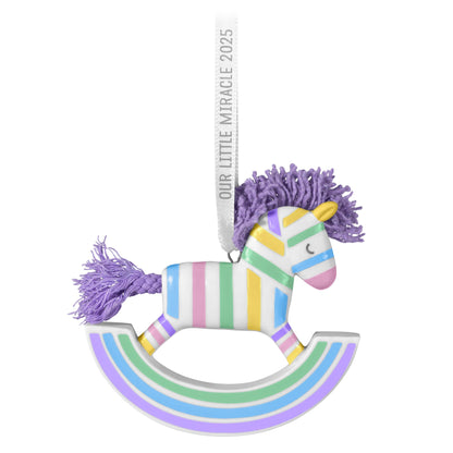 Our Little Miracle — 2025 Hallmark Keepsake Christmas Ornament, pastel striped rocking horse, porcelain with lavender details, close up view.