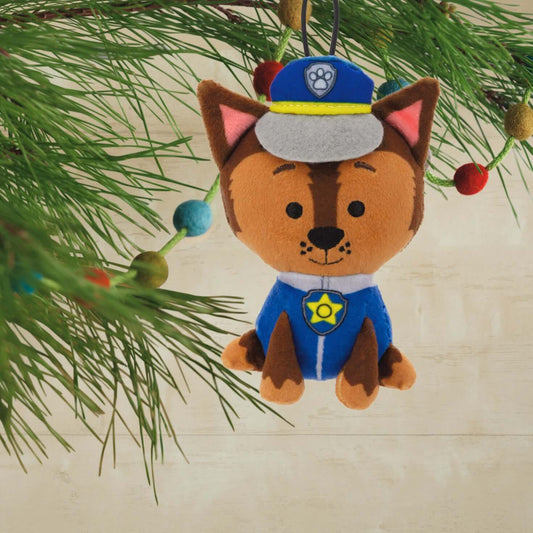Paw Patrol Chase, plush fabric - Hallmark Christmas ornament, cute design with police uniform, hanging on a Christmas tree branch.