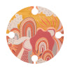 Abstract foldable picnic table in vibrant warm colours featuring a retro design with waves and clouds, flat lay view.