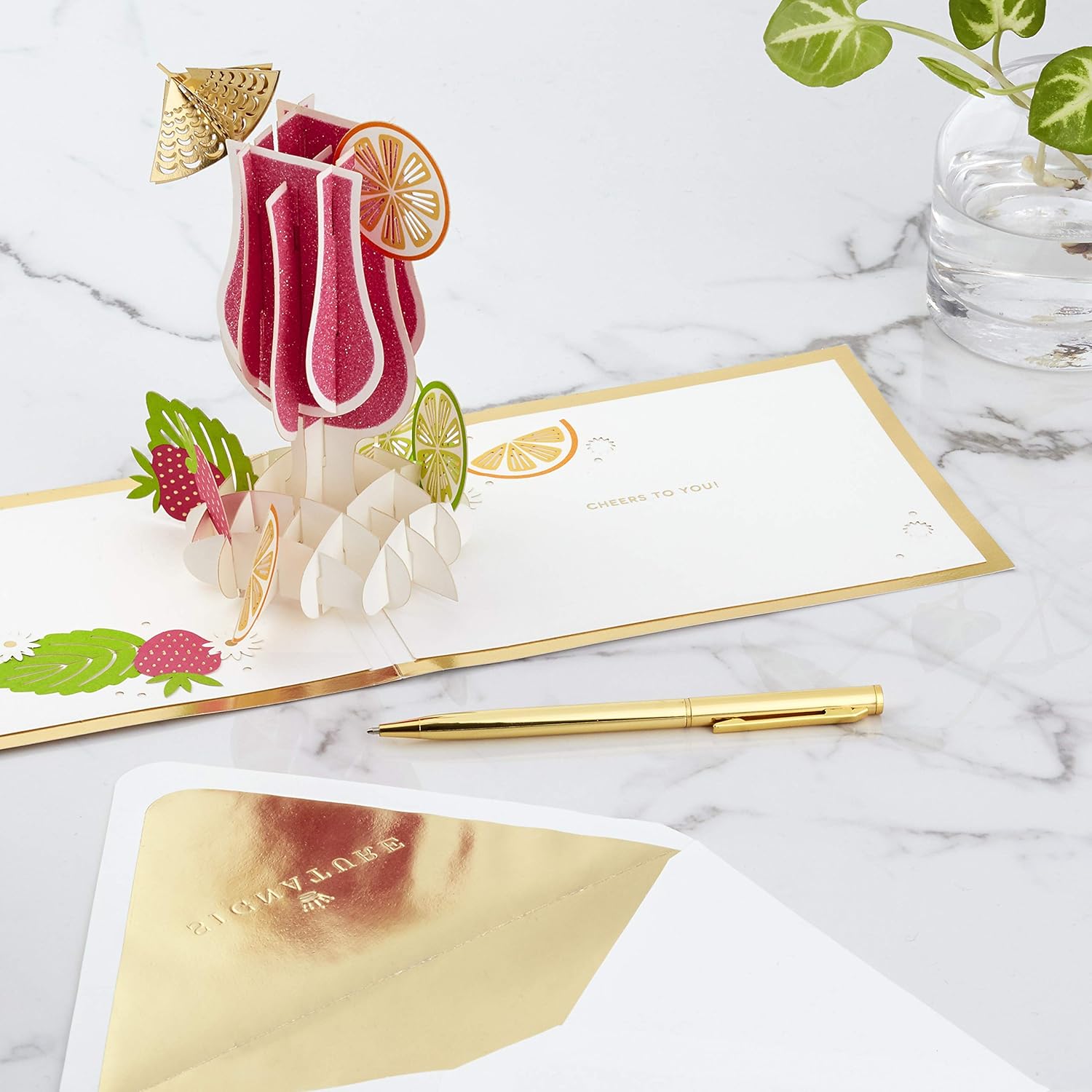 Hallmark Signature Paper Wonder Pop Up Congratulations Card, Birthday Card, College Graduation Card (Cheers, Tropical Drink) featuring an intricate pop-up tropical drink design with fruit details.