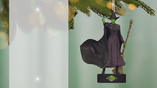 Wicked Defying Gravity With Sound — 2026 Hallmark Keepsake Christmas Ornament featuring the Wicked Witch of Oz in black dress and hat, hanging from a tree.
