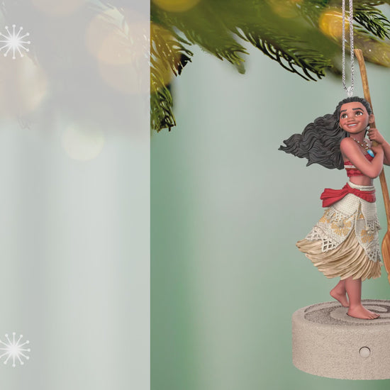 Disney Moana Ready for Adventure Musical — 2026 Hallmark Keepsake Christmas Ornament hanging from a tree branch, detailed design with oar.