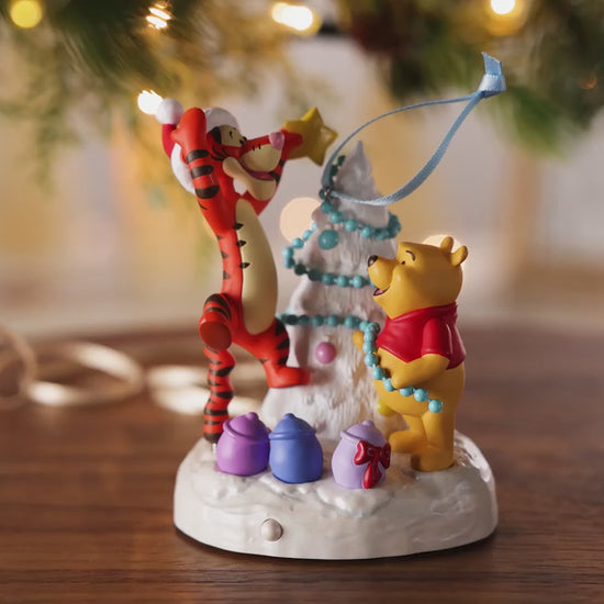 Disney Winnie the Pooh A Tigger-ific Tree Musical With Light — 2026 Hallmark Keepsake Christmas Ornament featuring Pooh Bear and Tigger decorating a tree.