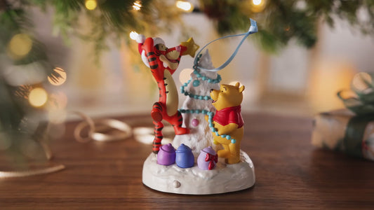 Disney Winnie the Pooh A Tigger-ific Tree Musical With Light — 2026 Hallmark Keepsake Christmas Ornament featuring Pooh Bear and Tigger decorating a tree.