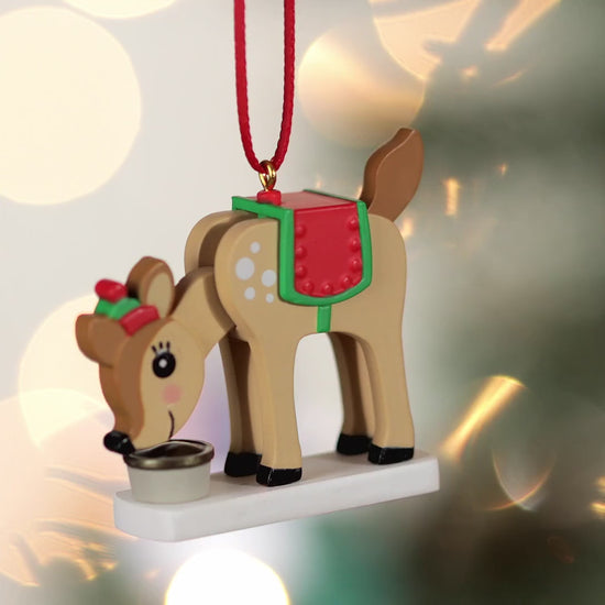 Season's Snackings (Miniature) — Hallmark Keepsake Christmas Ornament, plastic reindeer ornament with festive saddle and hat, close up