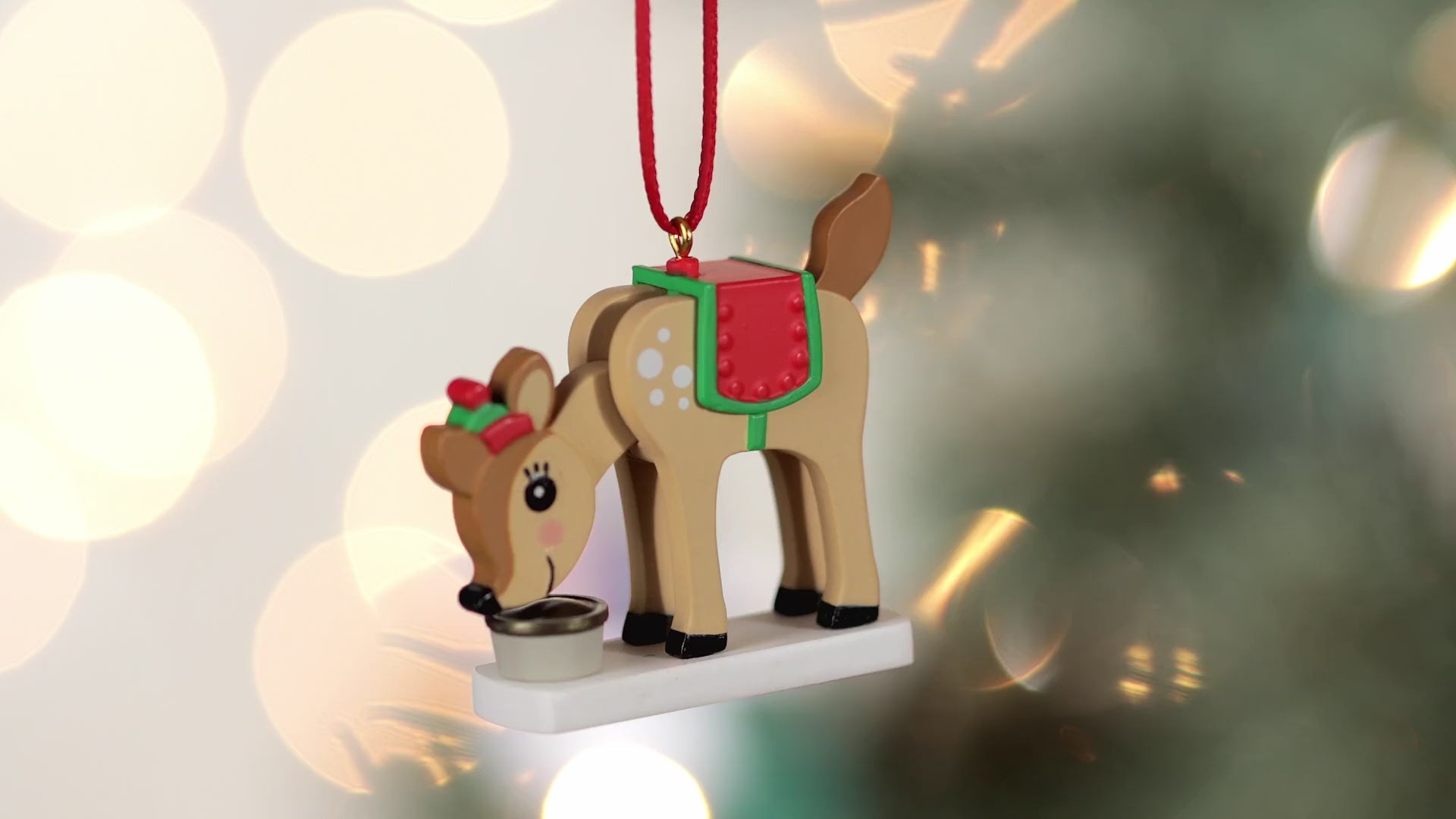 Season's Snackings (Miniature) — Hallmark Keepsake Christmas Ornament, plastic reindeer ornament with festive saddle and hat, close up