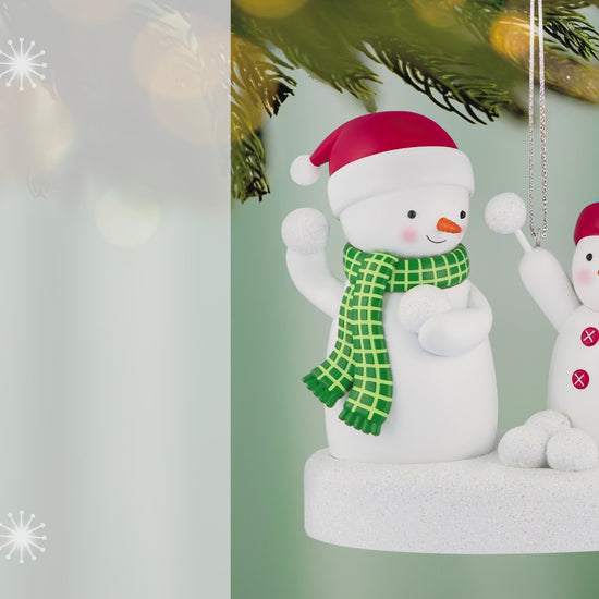 Snowball Fight 2026 Musical — 2026 Hallmark Keepsake Christmas Ornament featuring two playful snowmen in winter hats, captured during a snowball fight.
