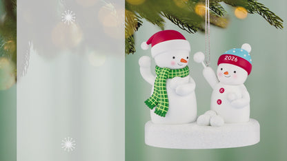 Snowball Fight 2026 Musical — 2026 Hallmark Keepsake Christmas Ornament featuring two playful snowmen in winter hats, captured during a snowball fight.