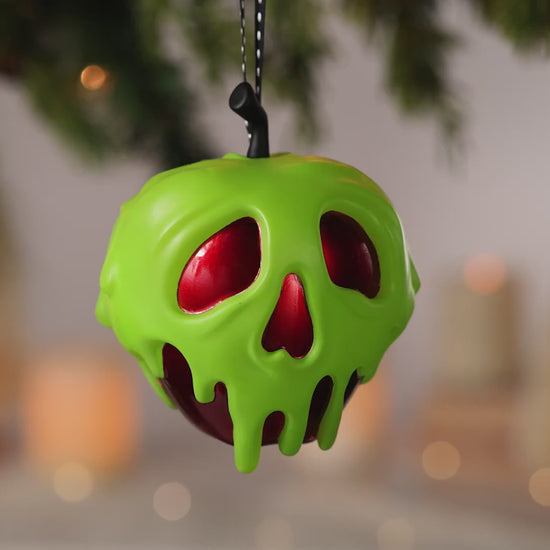 Disney Snow White and the Seven Dwarfs Just One Bite With Light — 2026 Hallmark Keepsake Christmas Ornament, green poison apple with skull detail, hanging decoration.