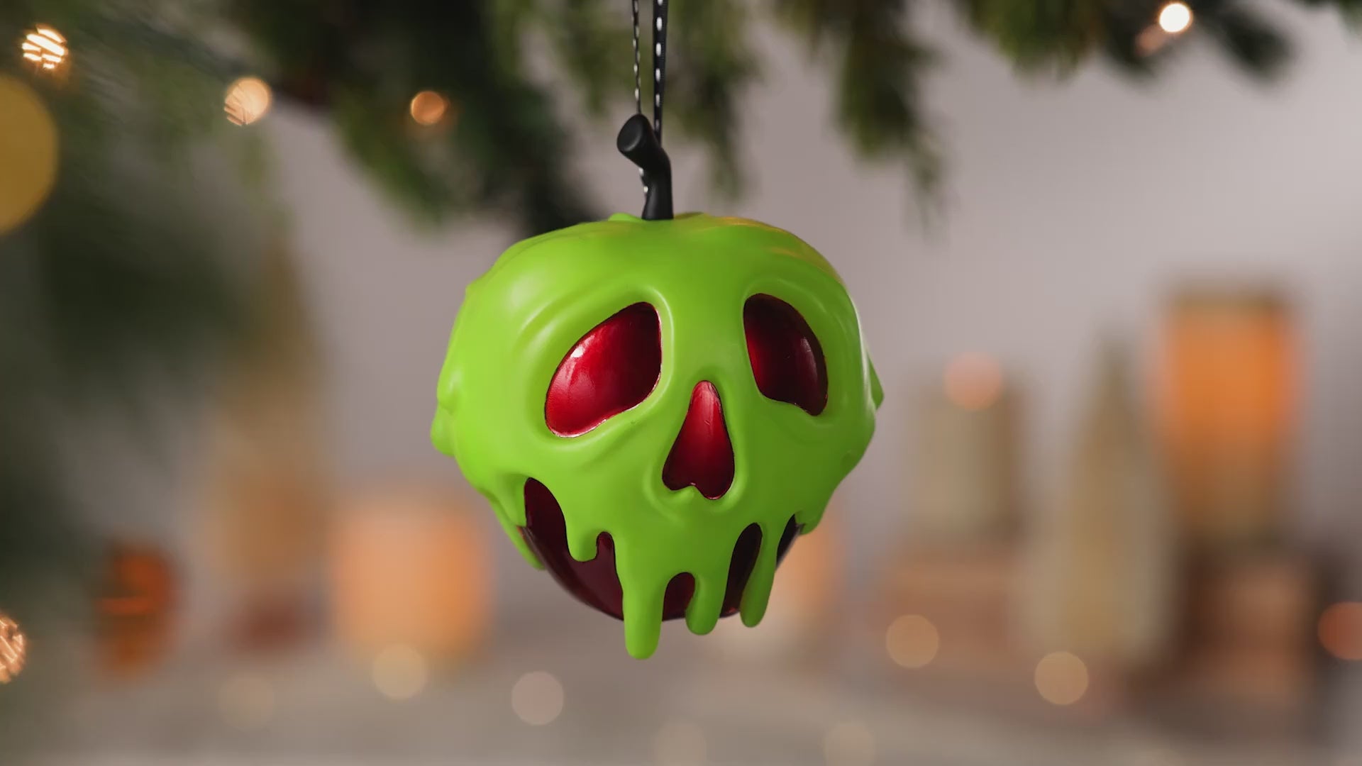 Disney Snow White and the Seven Dwarfs Just One Bite With Light — 2026 Hallmark Keepsake Christmas Ornament, green poison apple with skull detail, hanging decoration.