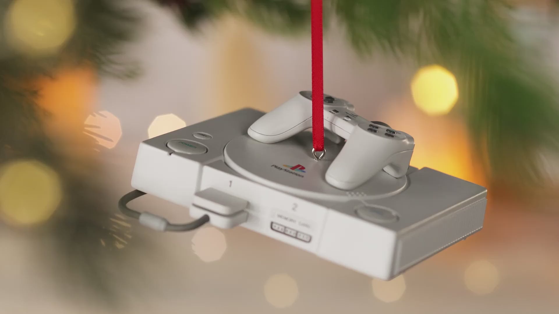 PlayStation™ Console With Light and Sound — 2026 Hallmark Keepsake Christmas Ornament hanging on tree, detailed view of controller and cord.