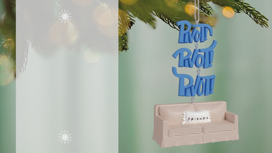 Friends Pivot! With Sound — 2026 Hallmark Keepsake Christmas Ornament featuring a couch and blue 'Pivot!' word art, close up view.