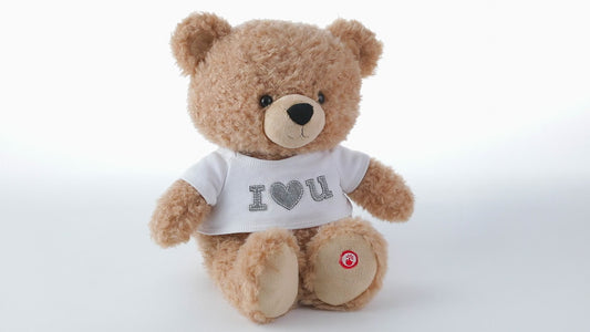 I Love You Bear Singing Stuffed Animal With Motion, 11'' in soft plush fabric, wearing a white t-shirt with 'I ❤️ U'.