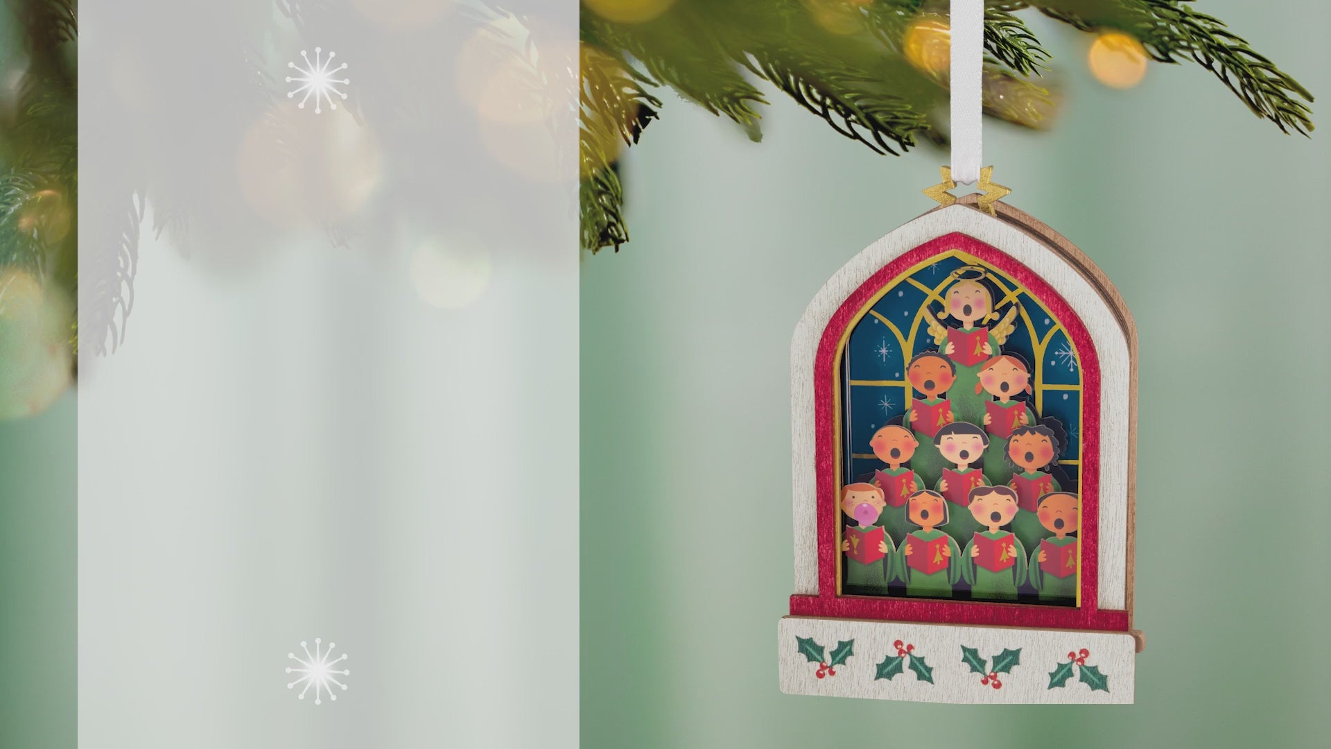 Lifting Their Voices Musical, Papercraft — 2026 Hallmark Keepsake Christmas Ornament, colourful children's choir design, hanging from a tree branch.