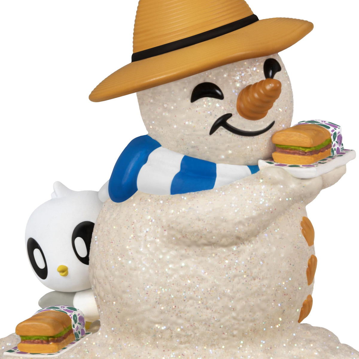 Sandal the Sandman 4th in the Series — 2025 Hallmark Keepsake Christmas Ornament, glittery snowman in a straw hat holding sub sandwiches with a sea turtle.