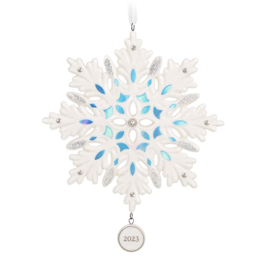 Snowflake (Porcelain) — 2023 Hallmark Keepsake Christmas Ornament with blue metallic accents and a 2023 date charm, flat lay view.