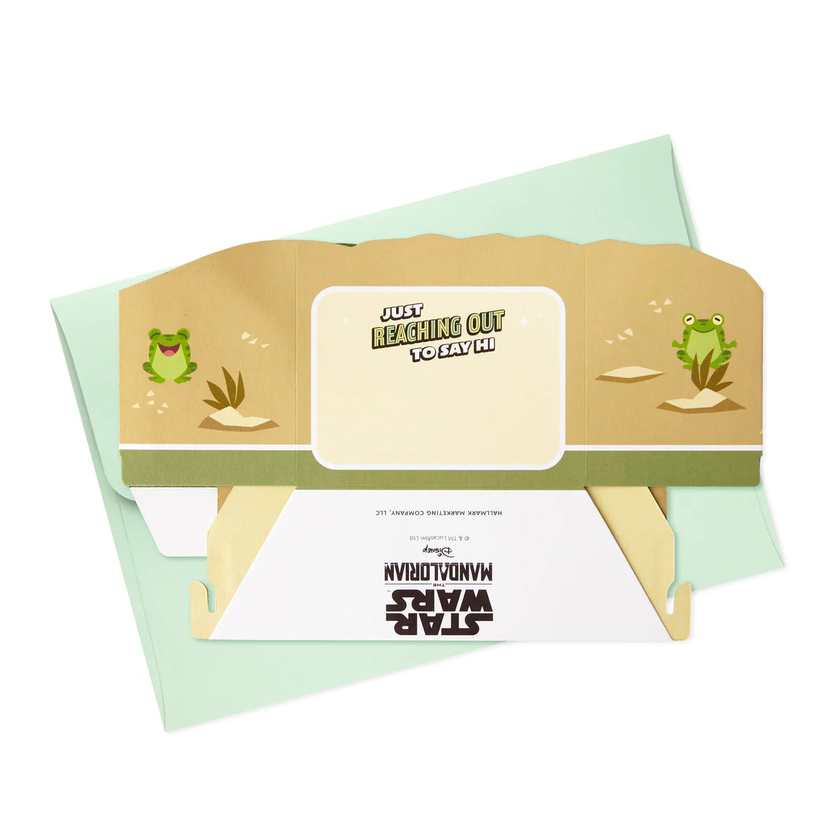 Hallmark Paper Wonder Star Wars™ Baby Yoda Pop Up Father's Day Card, Birthday Card, or Any Occasion (Reaching Out) with expressive green envelope and message detail in a flat lay view.