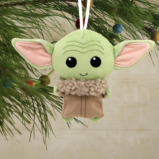 Star Wars™: The Mandalorian™ Grogu™, plush fabric Christmas ornament with cute facial features, hanging from a tree branch.