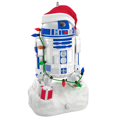 Star Wars™ Decked-Out Droid Musical — 2026 Hallmark Keepsake Christmas Ornament features R2-D2 in a Santa hat with string lights and a gift.